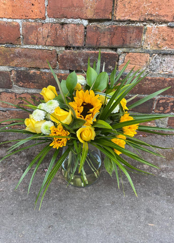 The perfect gift for a cheeky chappie, always a smile on his face and a twinkle in his eye.  This gorgeous bouquet for men by Make Their Day Florist is filled with blooming sunflowers, golden yellow roses accompanied by seasonal flowers and mixed foliage.