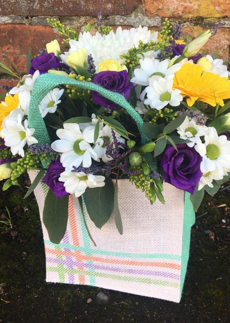 Our Rosa Parks Floral Gift Bag of white and green and blue is made up of white and Chrysanthemums, yellow Germinis, Solidago and spray Carnations, purple Lisianthus and Limonium. A gorgeous gift for your Mum on Mother's Day.