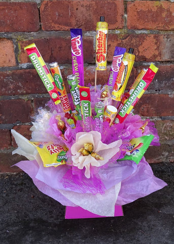 Each Sweets bouquet is hand-made to order, with lots of attention to detail and care. It is full of a good selection of sweets. We will add chocolate (no nuts!) for Luxury and Deluxe orders.  Please let us know if there is anything specific that you want us to include to brighten someone's day and put an extra big smile on their face!  Our sweet bouquet makes a tasty alternative for any occasion. We will cater for dietary requirements!