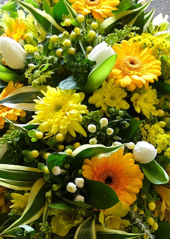 A shades of yellow seasonal hand tied bouquet for any occasion. from Make Their Day florist.