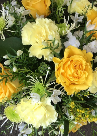 A yellow and white bouquet of seasonal flowers for any occasion from Make Their Day. Same day delivery in and around Monday to Saturday order by 3pm This bouquet is gift wrapped in cellophane and finished with a raffia bow