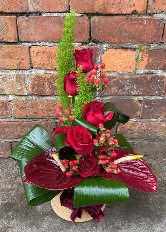 This show stopping design for men by Make Their Day Florist is guaranteed to make him feel special, filled with bright, bold flowers. This modern structured masterpiece is guaranteed to show him how special he is to you. 