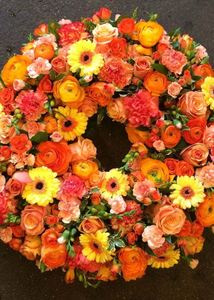 Orange and Yellow Loose Funeral Wreath - Make Their Day Florist